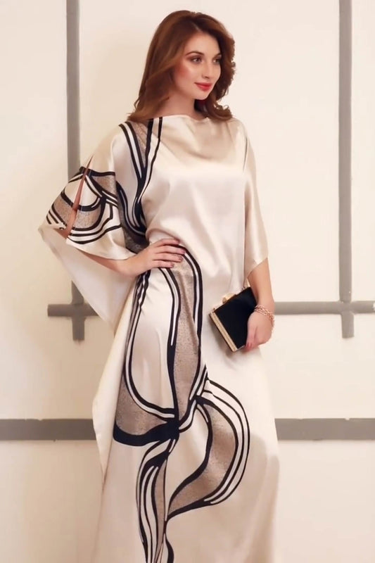 silk kaftan with abstract black and gold design, elegant drape, and modern cut ideal for upscale fashion and style