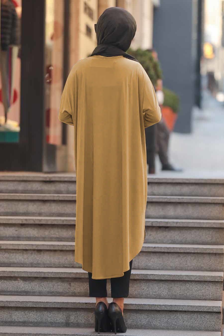 Beige modest tunic with leopard print details on pocket and side, perfect for a fashion forward modest wardrobe