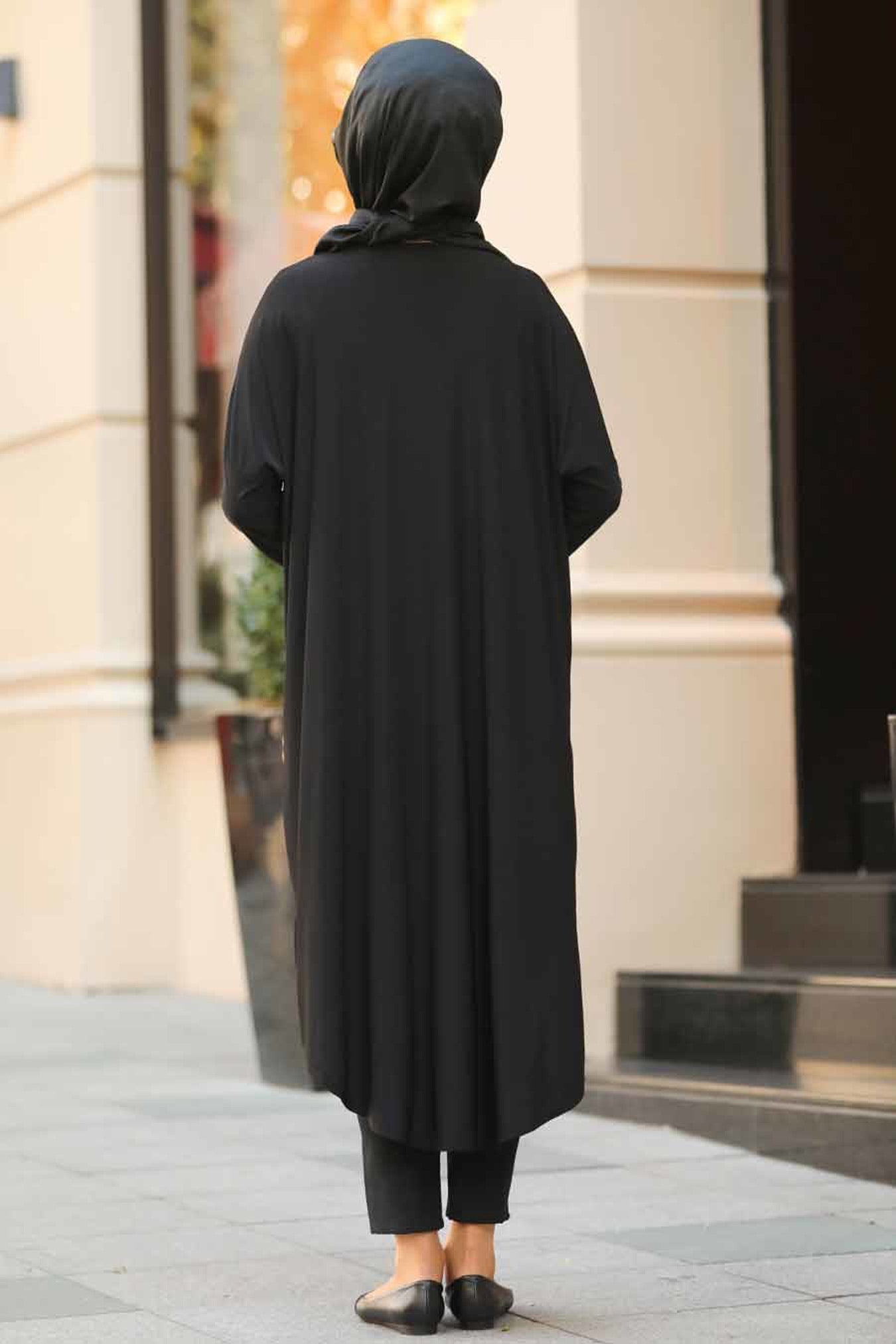 Black modest tunic with leopard print details on pocket and side, perfect for a fashion forward modest wardrobe