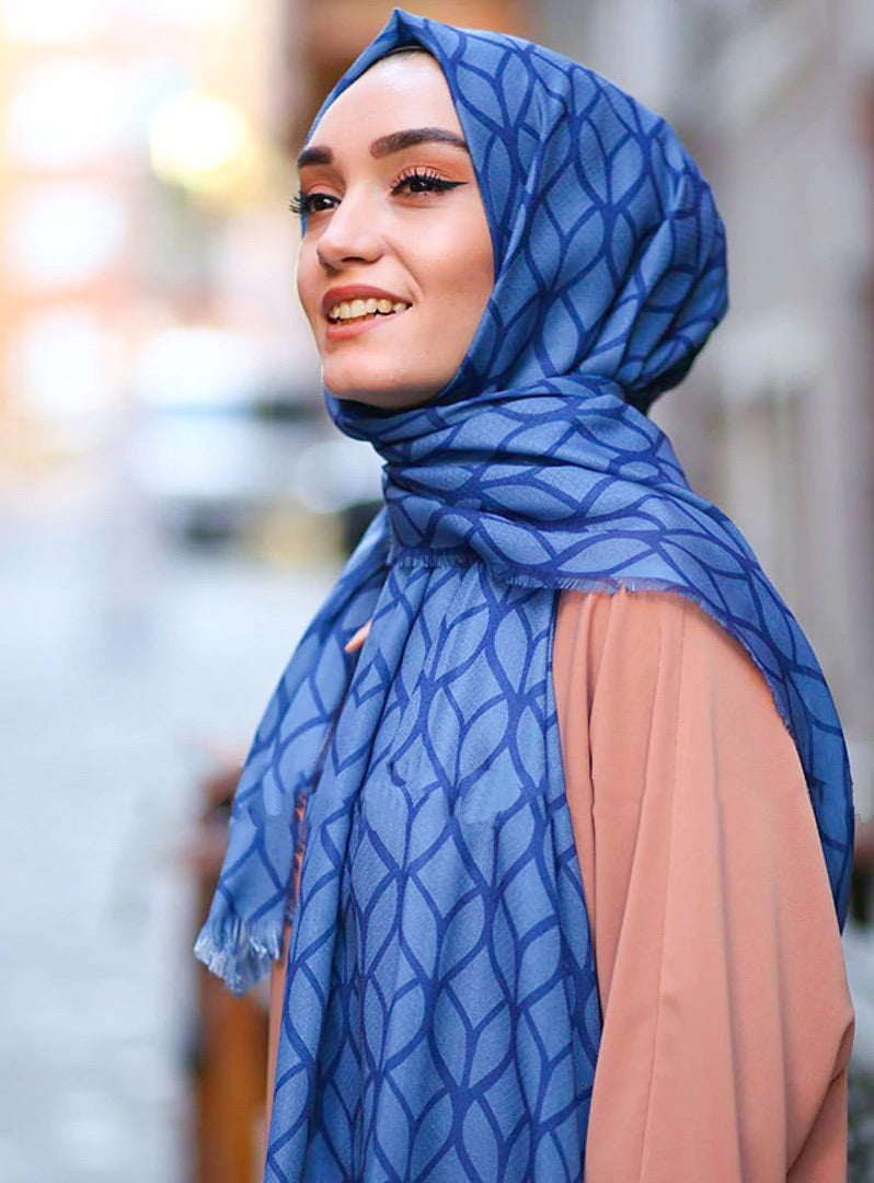 Blue Color Hijab in rich hues, featuring intricate patterns for a sophisticated look, combining style with modesty for the fashion conscious