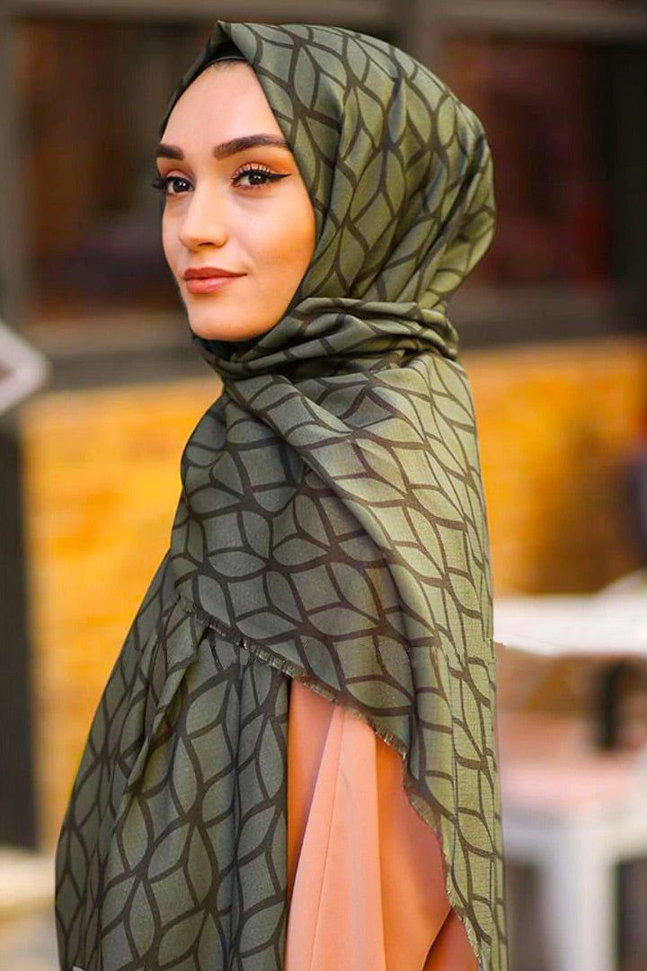 Olive Color Hijab in rich hues, featuring intricate patterns for a sophisticated look, combining style with modesty for the fashion conscious