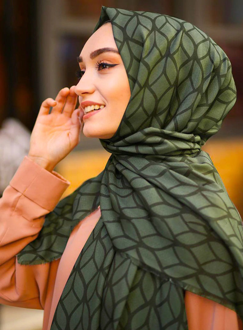 Olive Color Hijab in rich hues, featuring intricate patterns for a sophisticated look, combining style with modesty for the fashion conscious