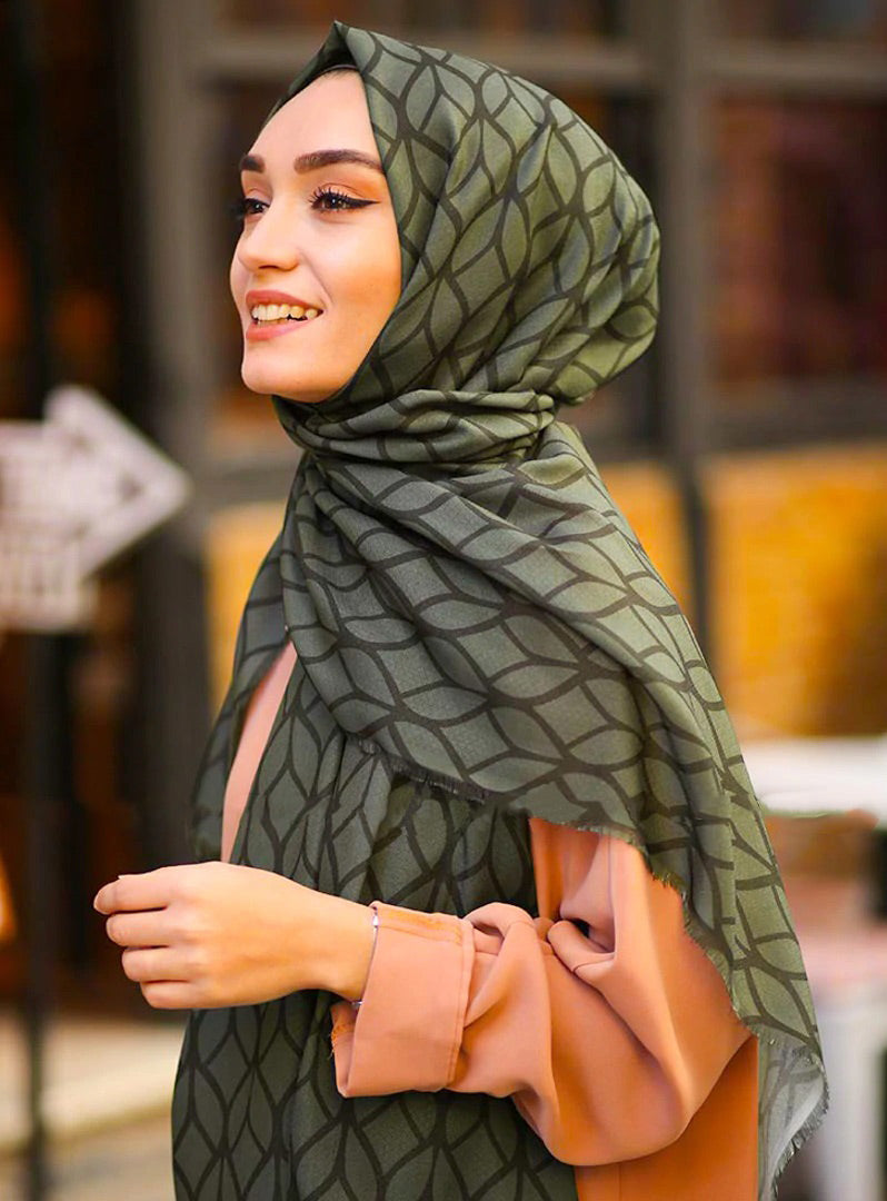 Olive Color Hijab in rich hues, featuring intricate patterns for a sophisticated look, combining style with modesty for the fashion conscious