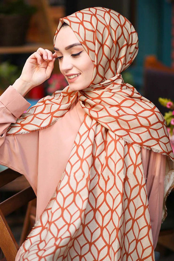 Orange Color Hijab in rich hues, featuring intricate patterns for a sophisticated look, combining style with modesty for the fashion conscious