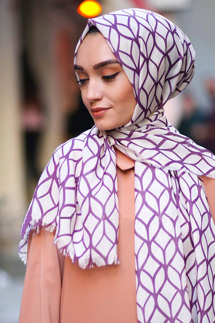 Purple Color Hijab in rich hues, featuring intricate patterns for a sophisticated look, combining style with modesty for the fashion conscious
