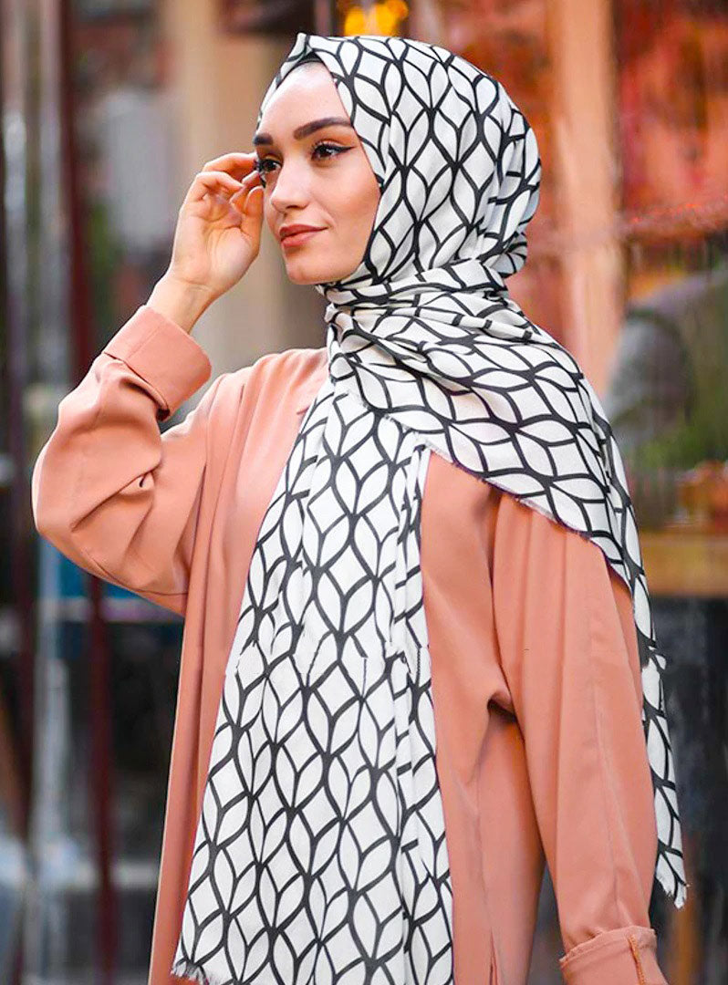 White Color Hijab in rich hues, featuring intricate patterns for a sophisticated look, combining style with modesty for the fashion conscious