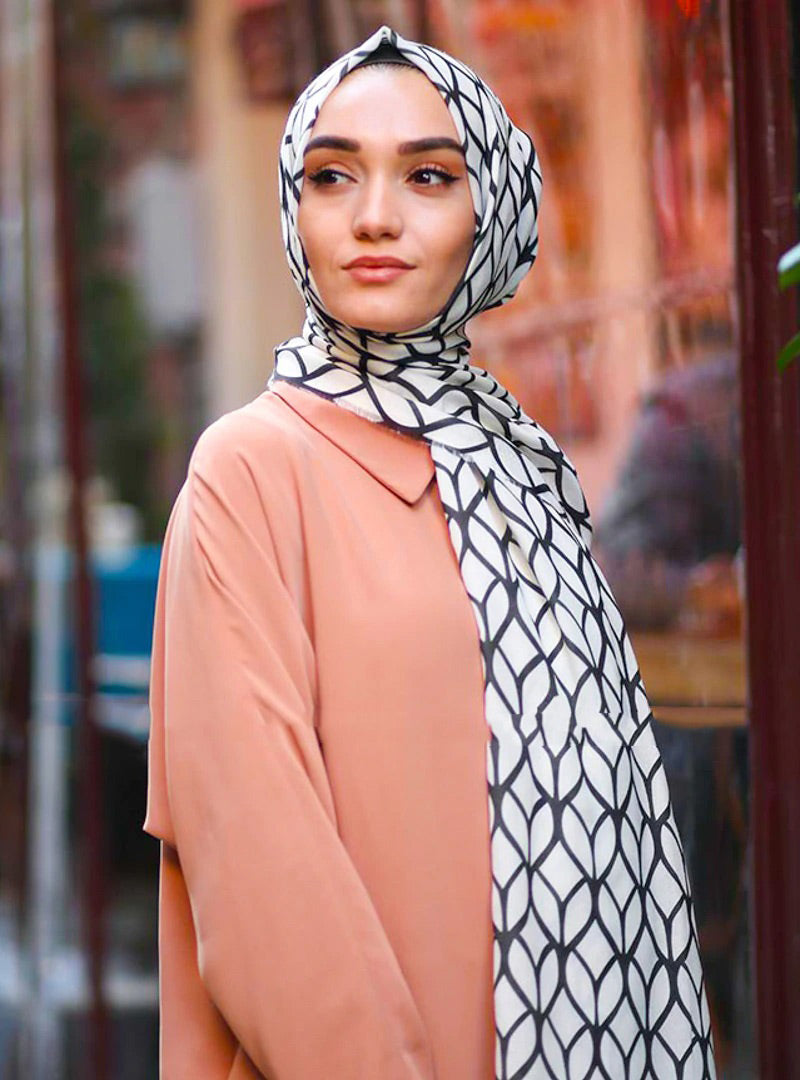 White Color Hijab in rich hues, featuring intricate patterns for a sophisticated look, combining style with modesty for the fashion conscious