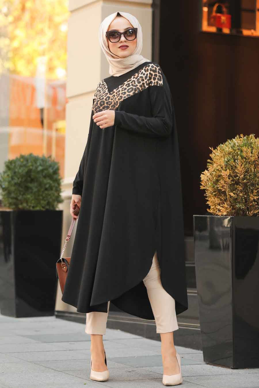 Womens tunic with leopard print accents, available in various colors, perfect for versatile fashion styles
