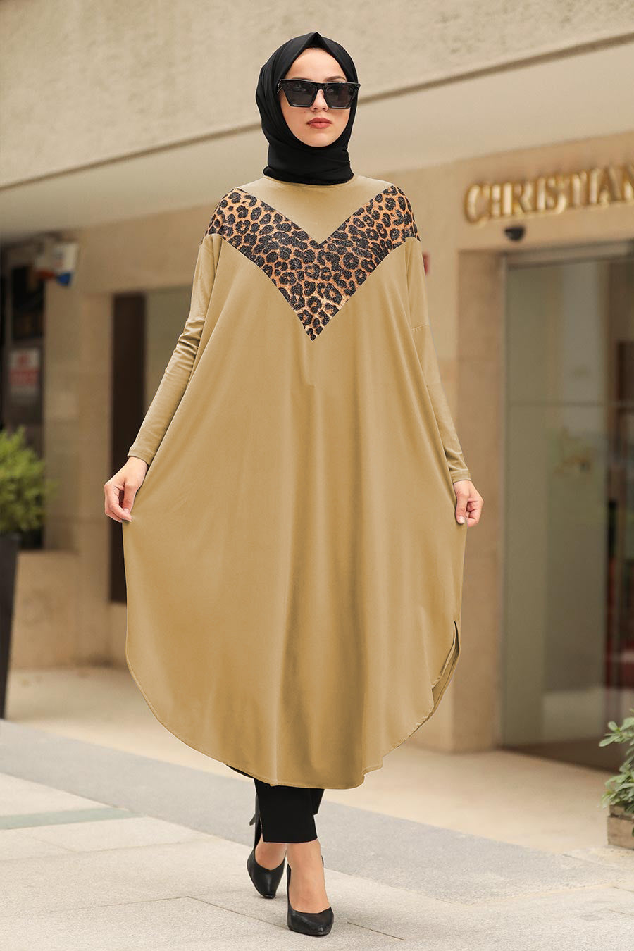 Womens tunic with leopard print accents, available in various colors, perfect for versatile fashion styles