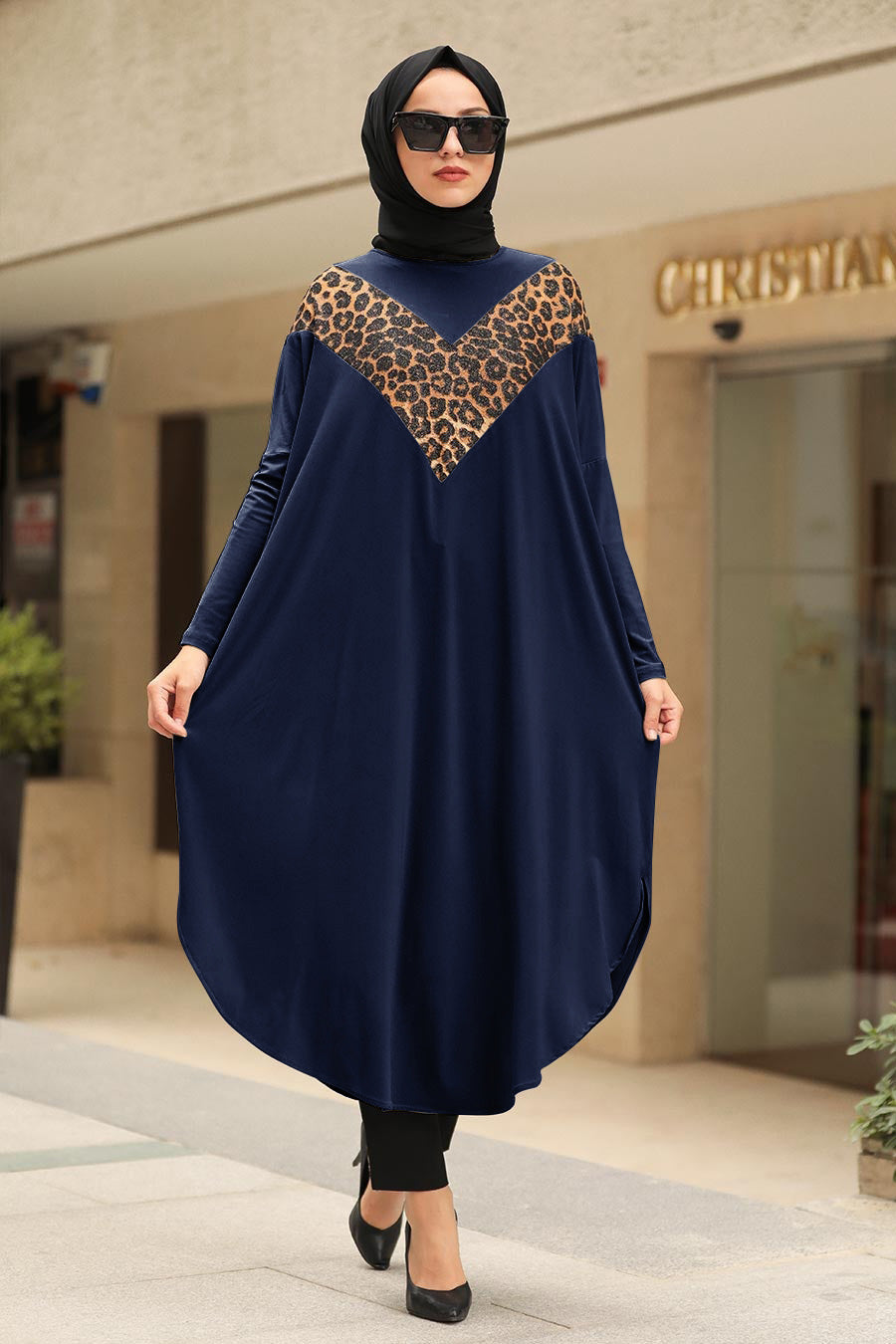 Womens tunic with leopard print accents, available in various colors, perfect for versatile fashion styles