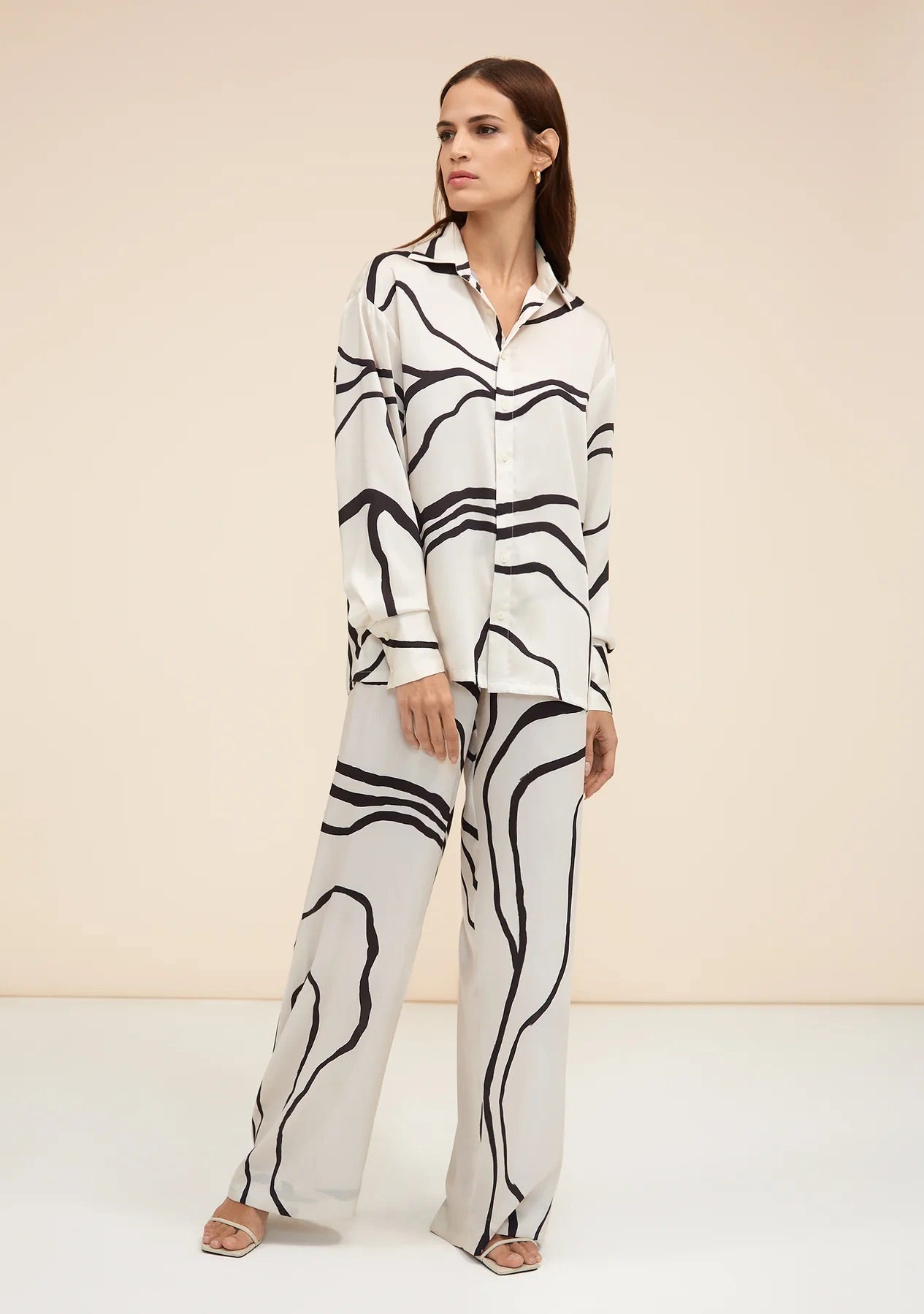Black abstract pattern co-ord set with wide leg pants and button up shirt fashionable womenswear 