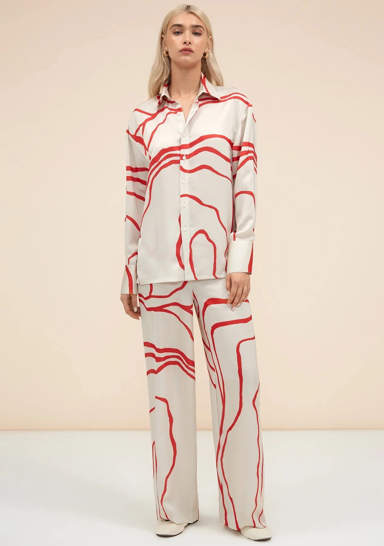 Red abstract pattern co-ord set with wide leg pants and button up shirt fashionable womenswear 