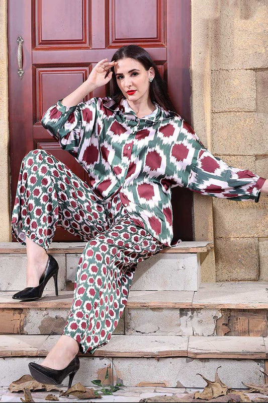 Autumn-inspired geometric print co-ord set with a blouse and trousers in deep red and green