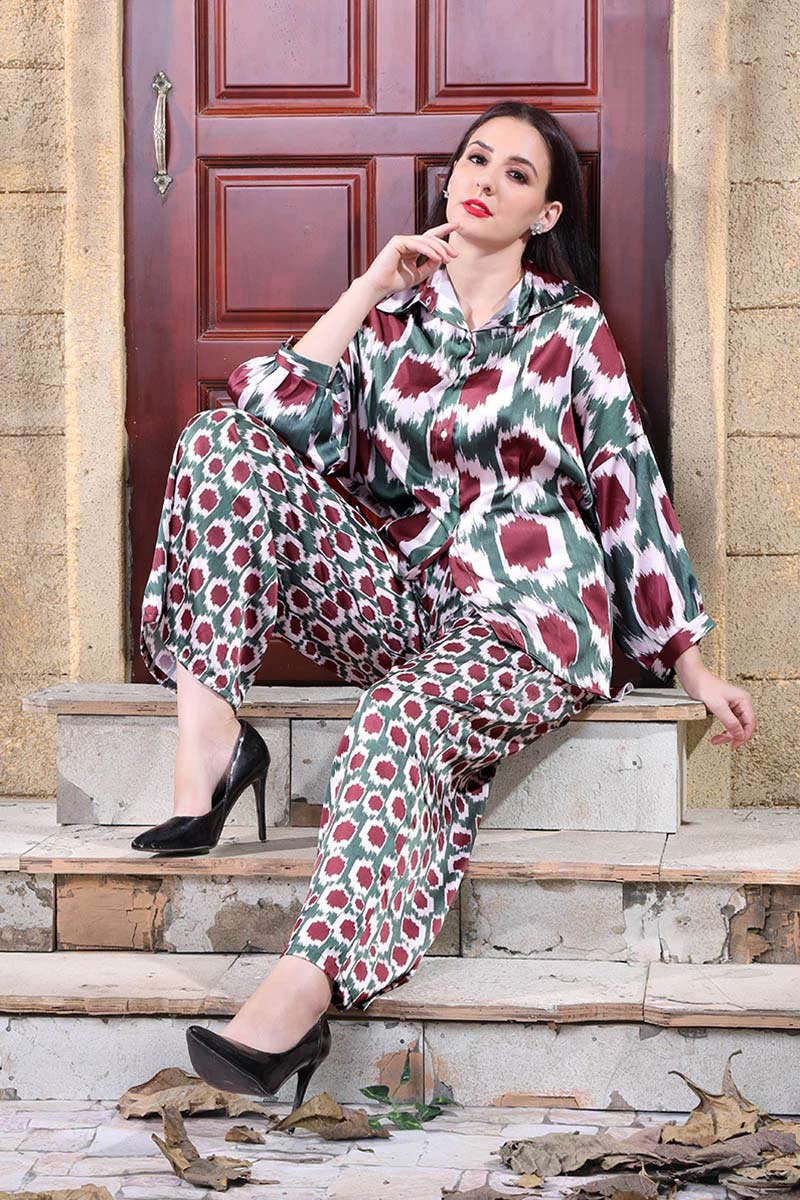 Autumn-inspired geometric print co-ord set with a blouse and trousers in deep red and green