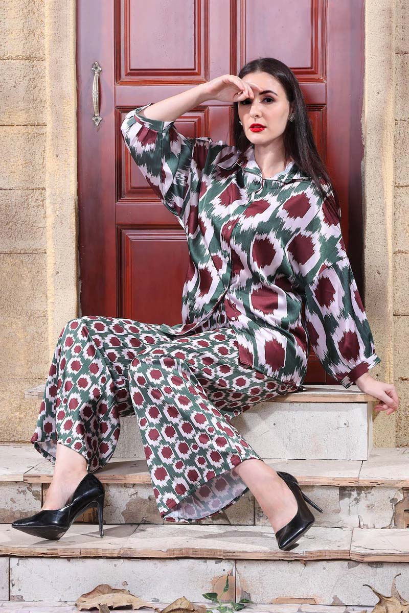 Autumn-inspired geometric print co-ord set with a blouse and trousers in deep red and green