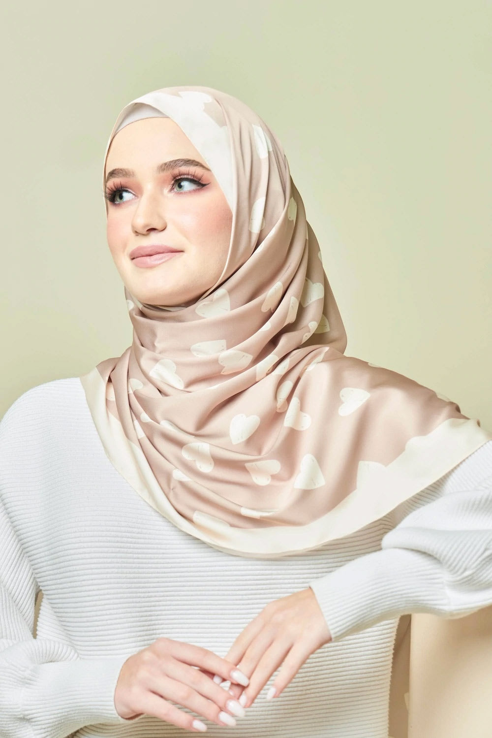 Beige heart patterned hijab on a model  top rated for modest fashion and stylish headscarves