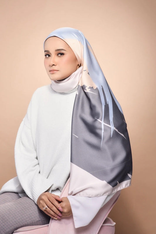 Woman wearing a Scarf featuring a sky inspired print for a modern, elegant look in modest fashion