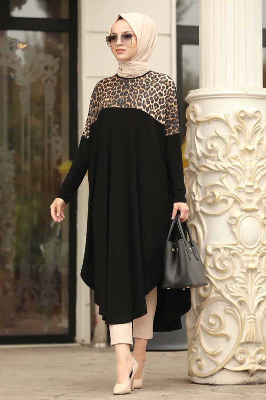  A woman in an elegant, modest black dress with a patterned high neck bodice,