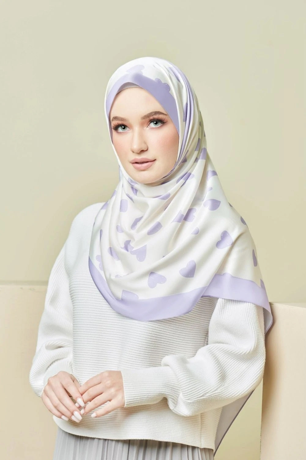 woman wearing a Lavender Love Hijab with a heart pattern, offering a blend of style and modesty, ideal for top fashion and Islamic wear