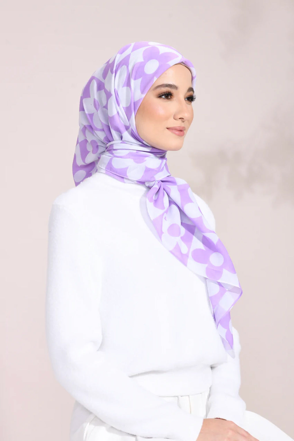 Lilac Blossom Hijab with white floral pattern on a light fabric, perfect for stylish modest fashion enthusiasts