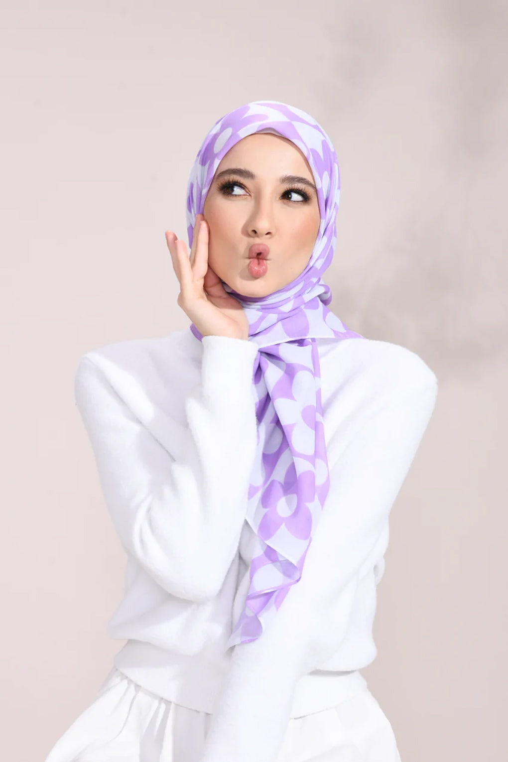 Lilac Blossom Hijab with white floral pattern on a light fabric, perfect for stylish modest fashion enthusiasts